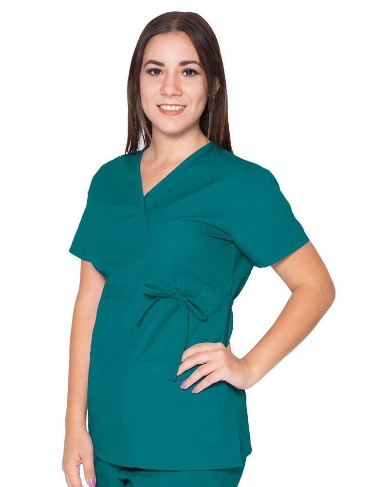 
                      
                        Filipina para dama con bolsas frontales de Ditmo Uniformes color turquesa con moño decorativo
                      
                    